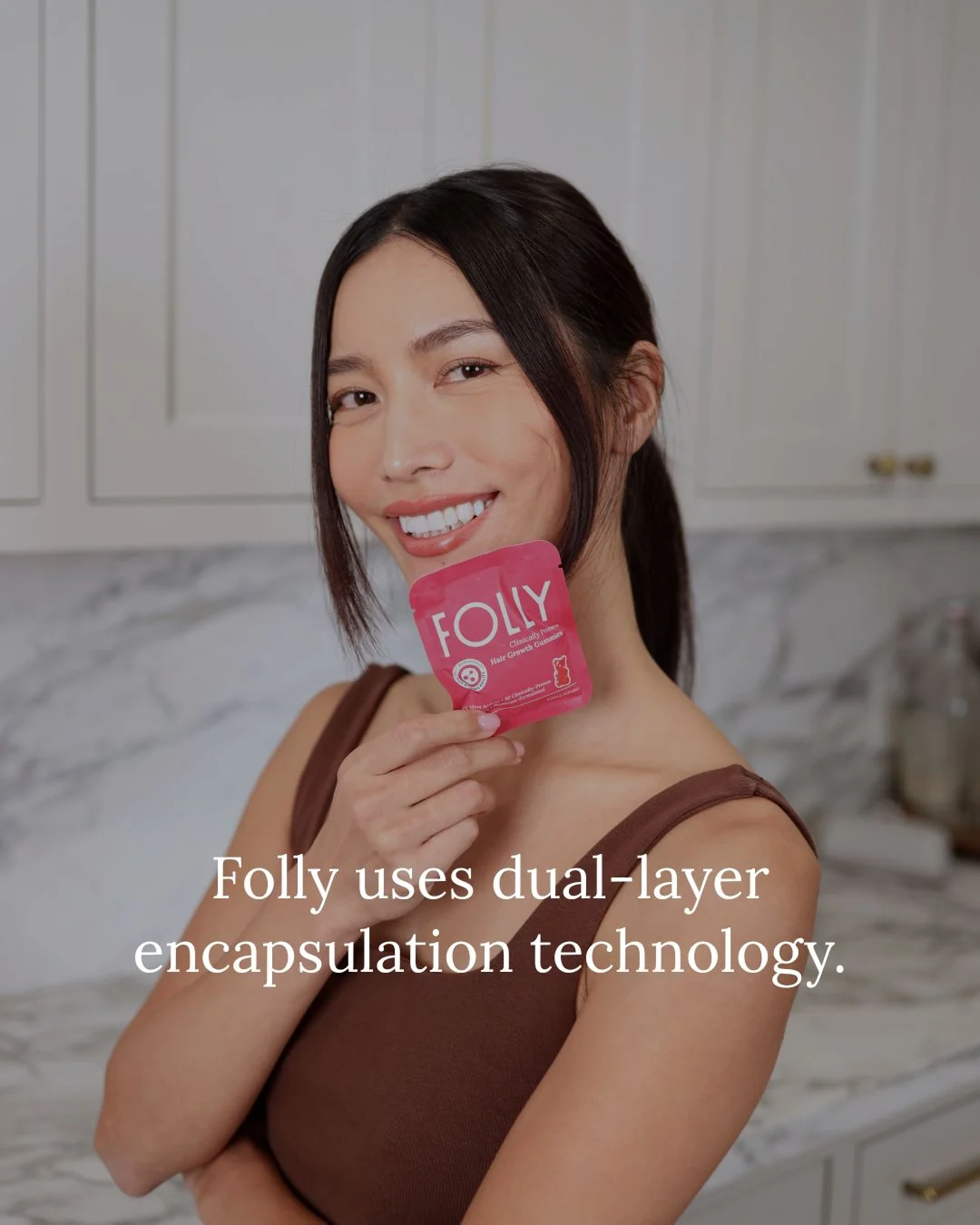 Folly customer holding a pink gummy sachet